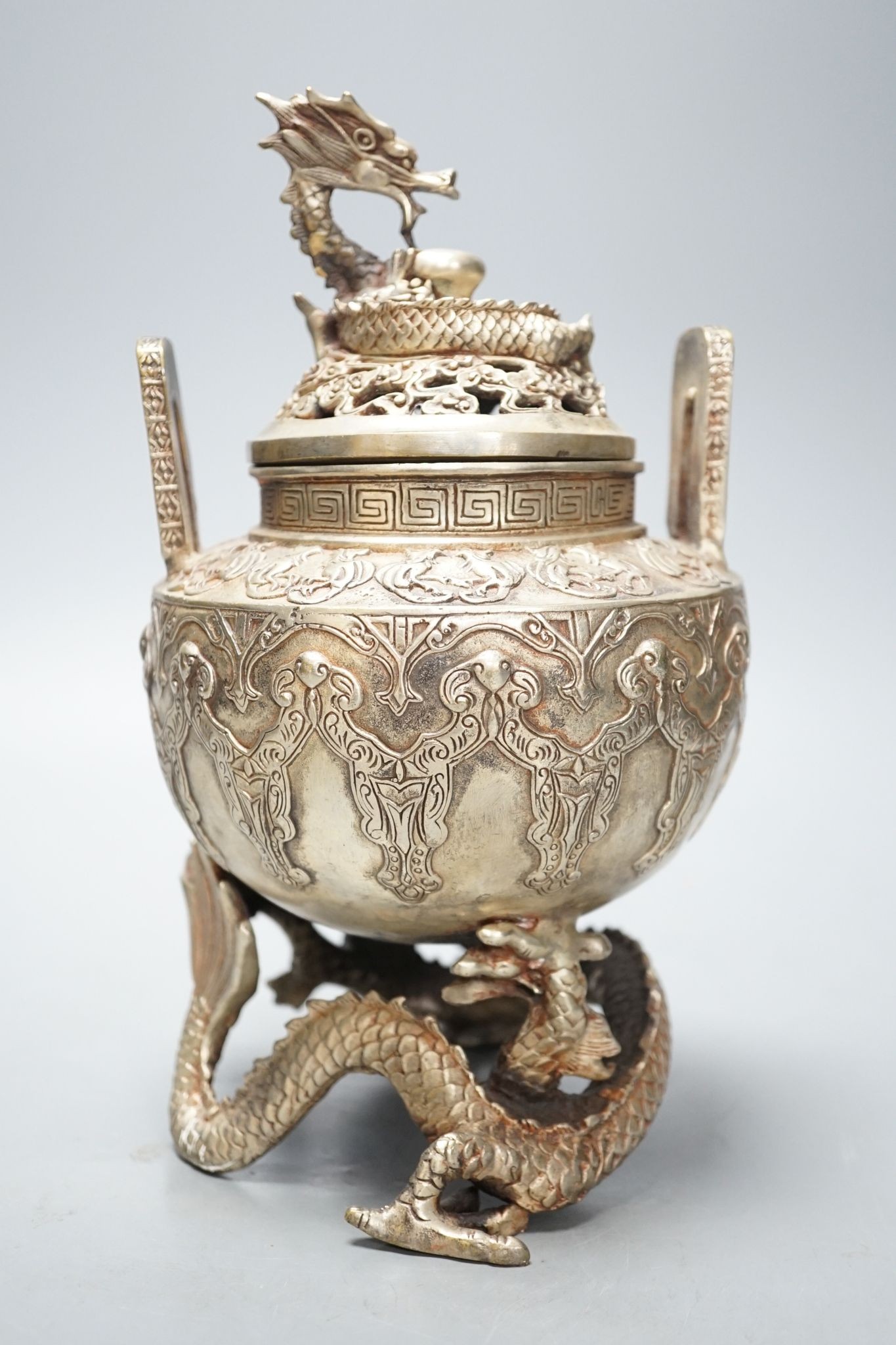 A Chinese bronze 'dragon' censer and cover, 24.5 cms high